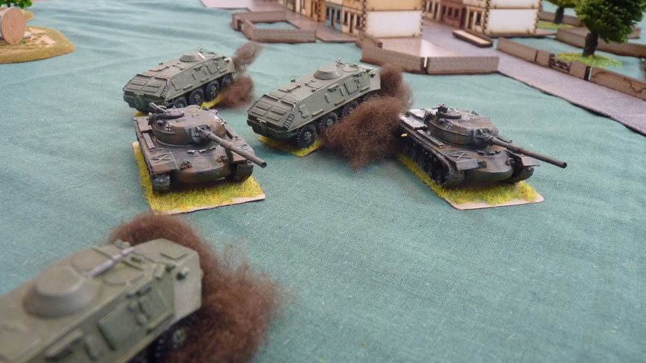 West German M48s drive between burning Soviet armoured vehicles